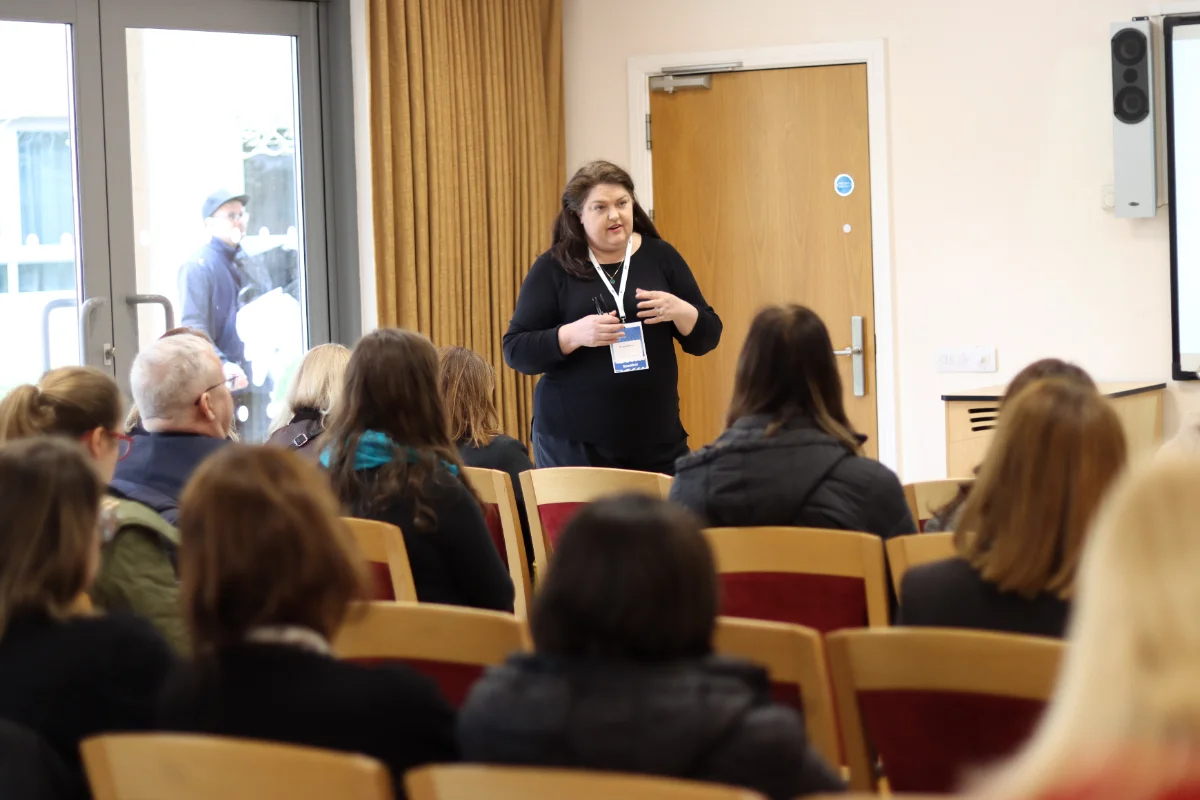 Demo photo: presenter at a conference session